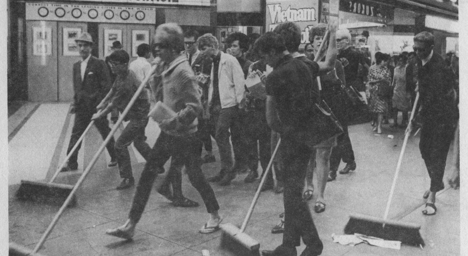Group of queer homeless youth and allies in San Francisco's Tenderloin district (ca. 1968), called Vanguard, amidst a 'Street Sweep' action in response to attacks by city and corporate interests that worked to rid the city of queer houseless people